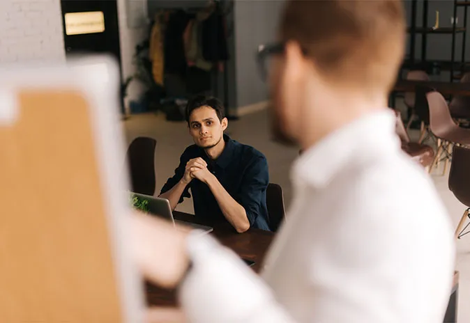 Client listening to presentation on whiteboard